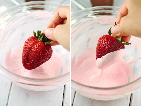 将草莓浸入巧克力与红色食物着色