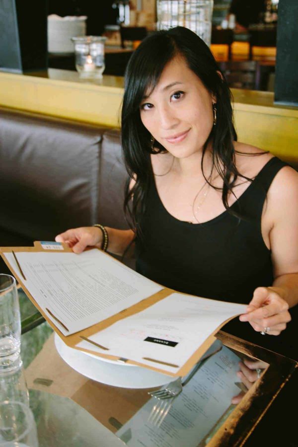 jessica looking at the menu inside ad hoc restaurant