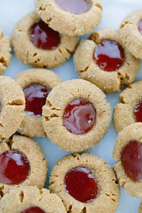 top down view of thumbprint cookies with jam in the middle