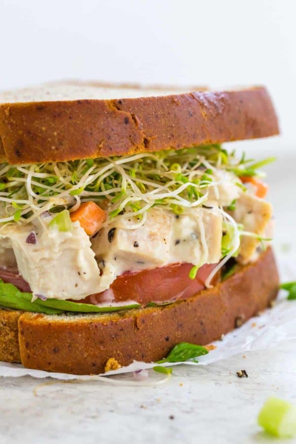 Closeup photo showing the inside of a chicken salad sandwich