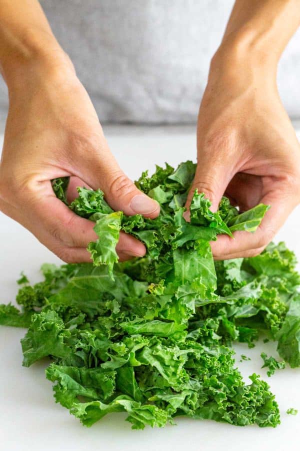 massaging kale leaves